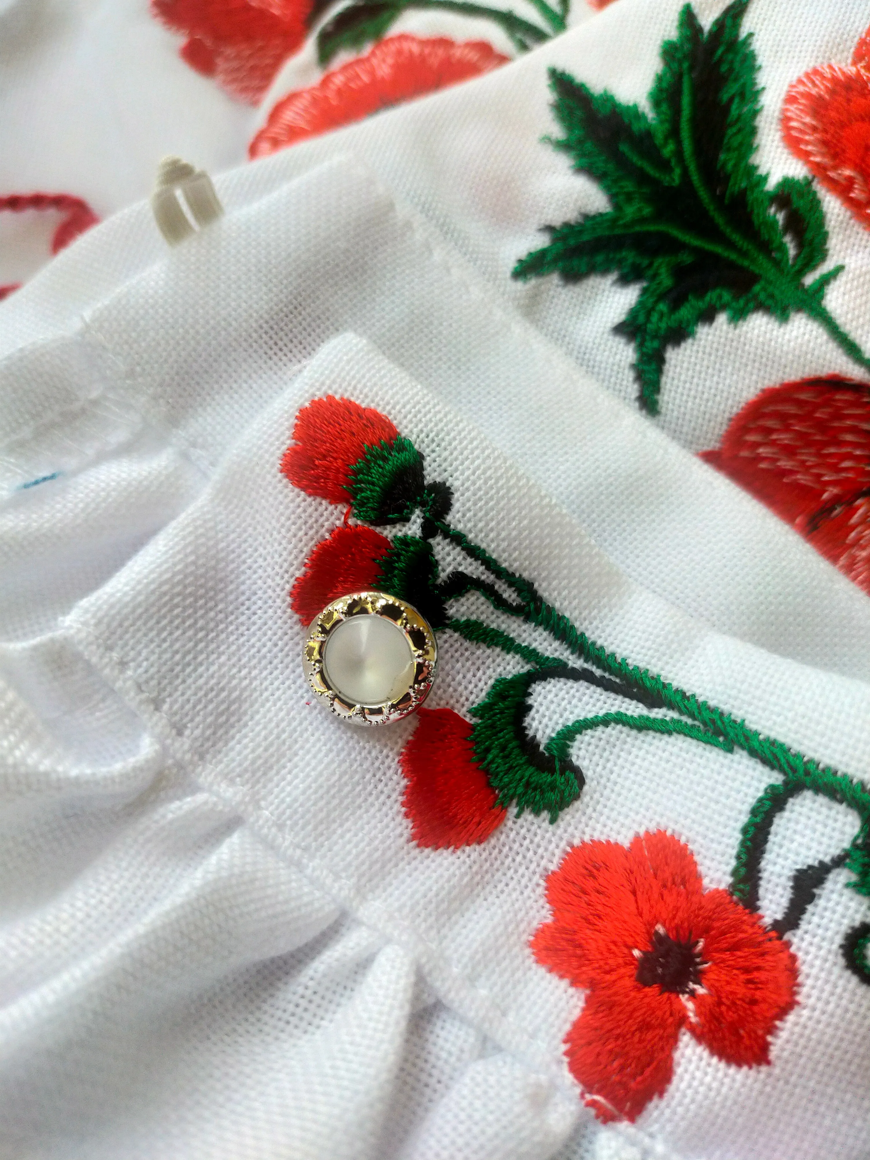 Female embroidered blouse with poppies