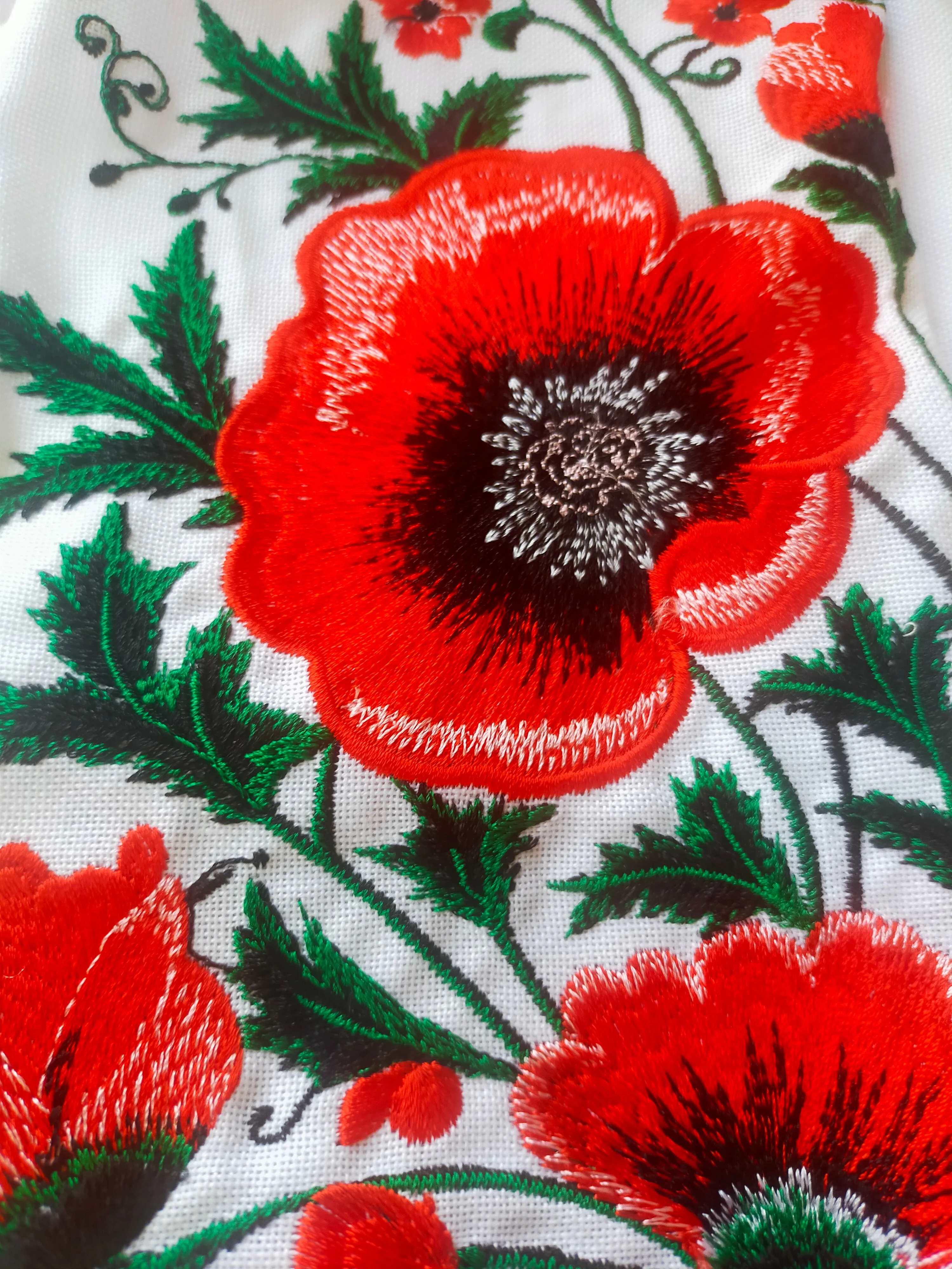 Female embroidered blouse with poppies